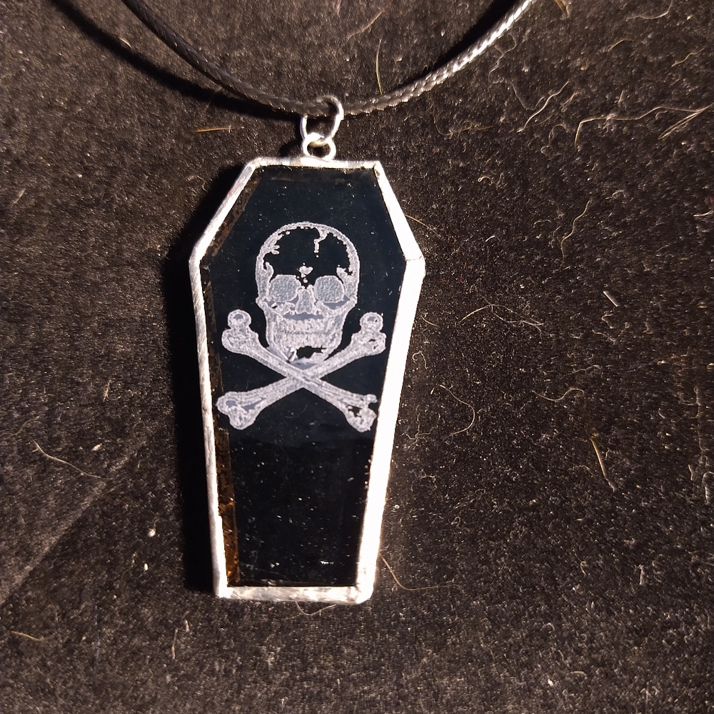 Stained glass skull and crossbones coffin pendant